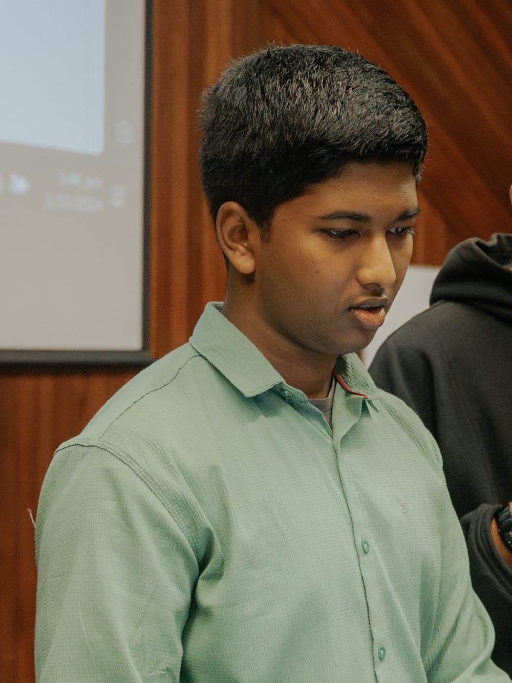 Mohamed Aslam speaking at a technology workshop